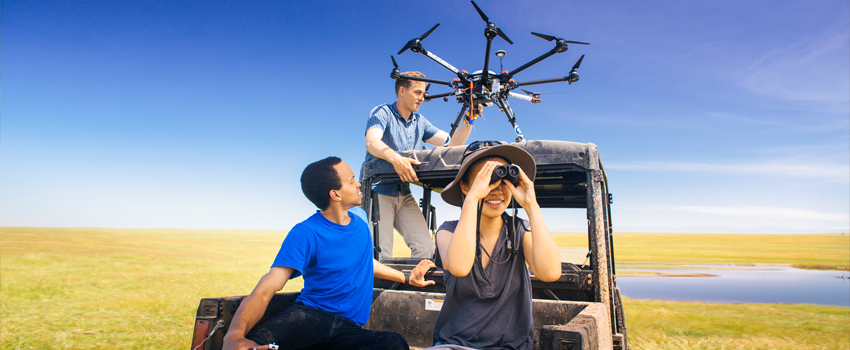 UC Merced Extension - Students preparing to launch drone in the pastures behind UC Merced.